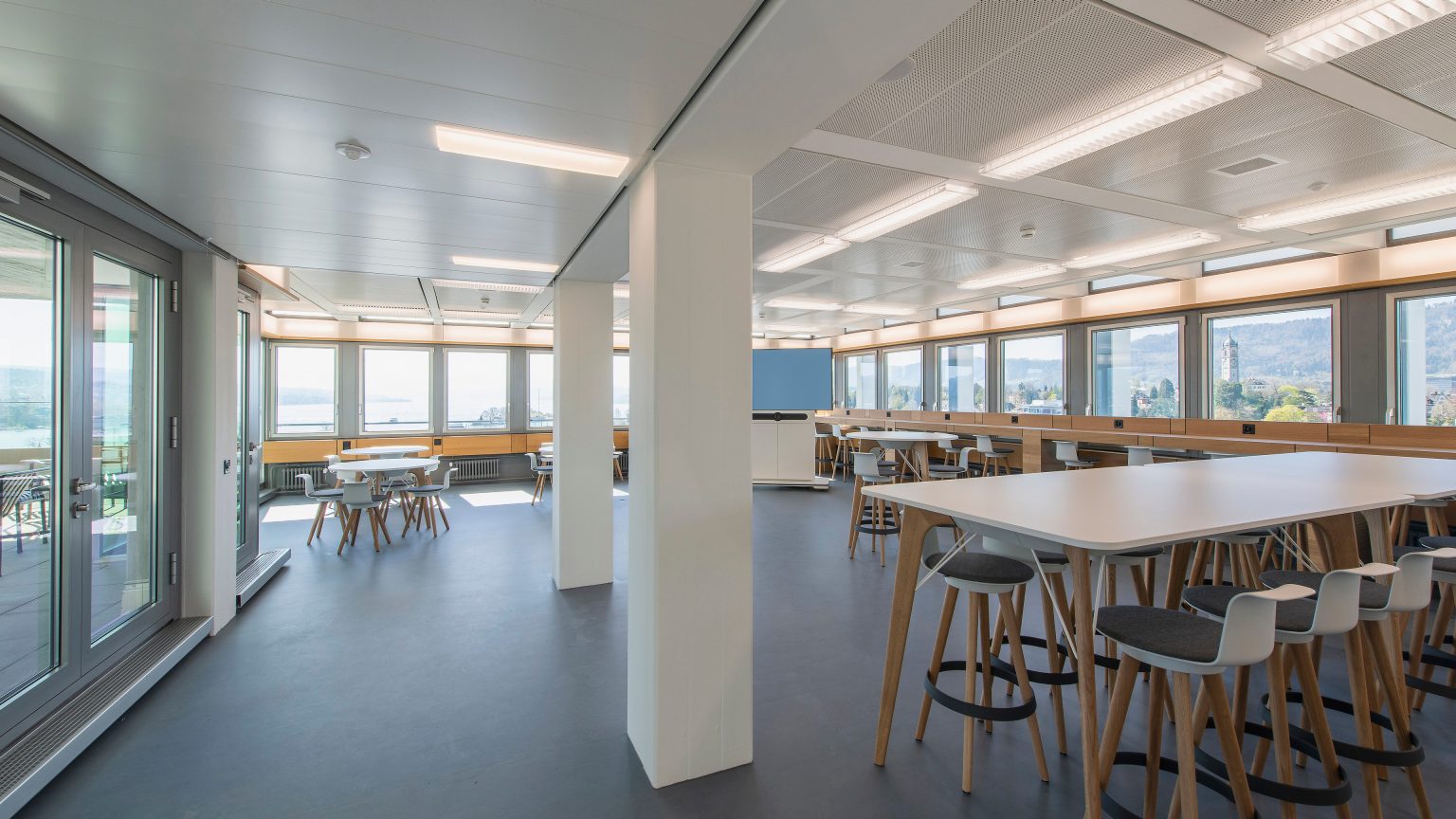 A café with seating and a view of Zurich.