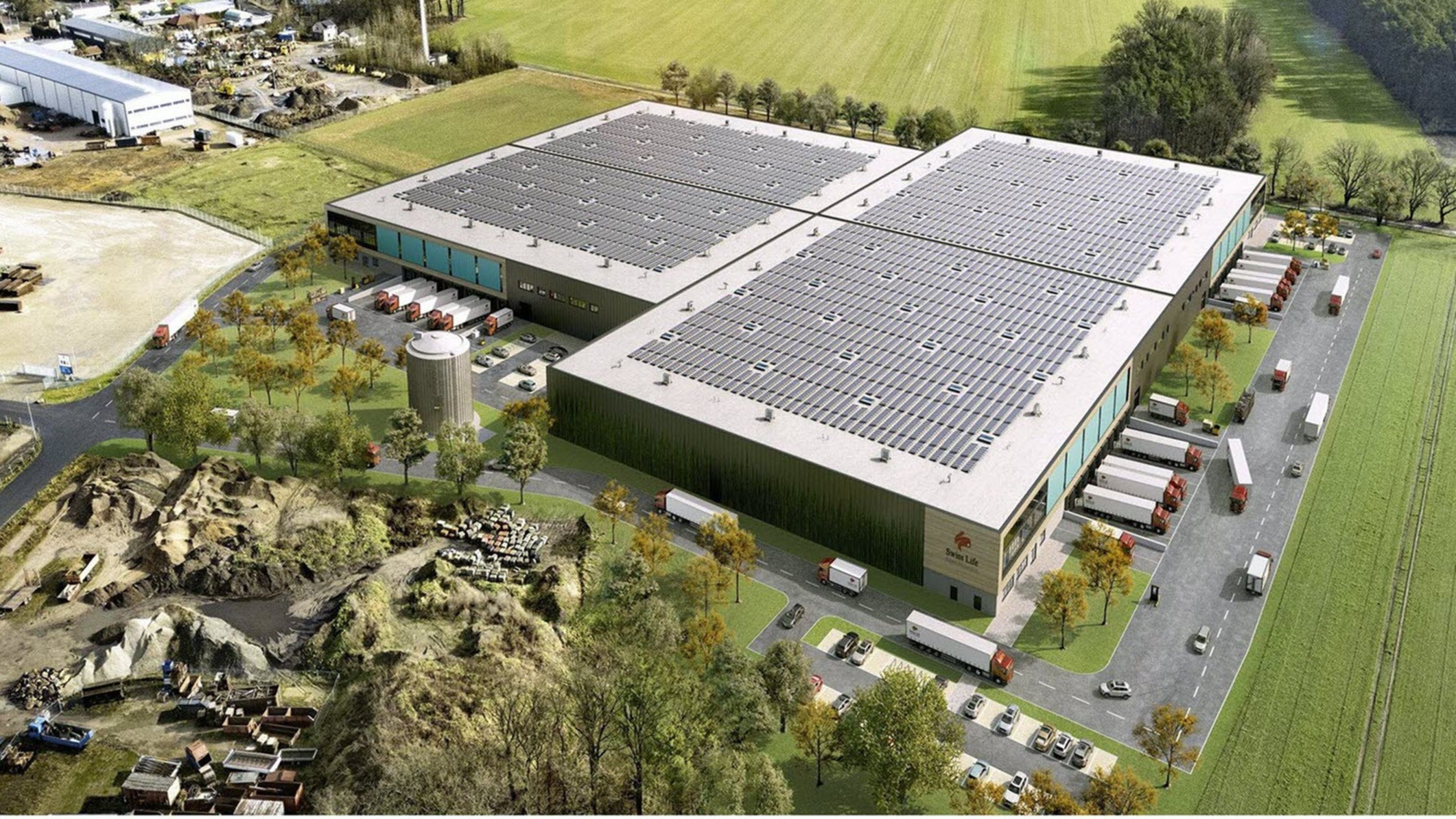 A logistics building with trucks.